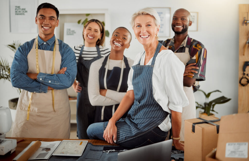 group of five cheerful diverse clothing designers utc
